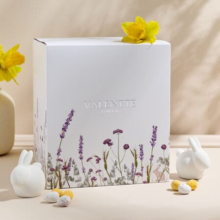 Our easter mystery box, showcasing a large box surrounded with easter themed items and flowers