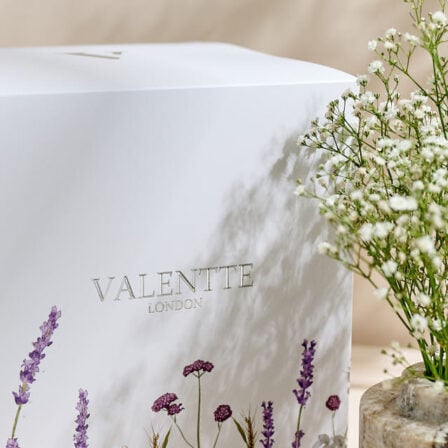 Our mystery box, showcasing a large box surrounded with Flowers and vase's