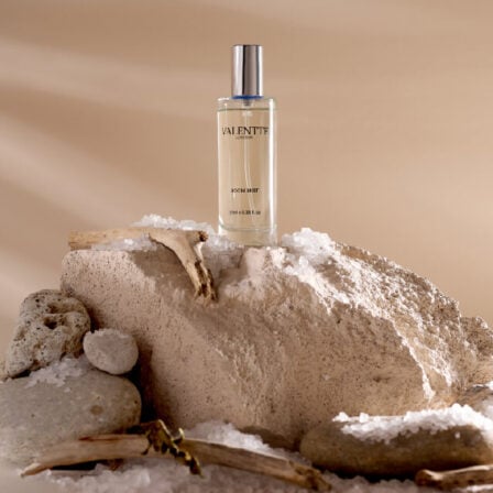 Our sea salt room mist, sat on a rock, surrounded by sea salt