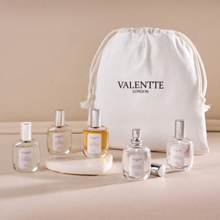 Main images of our Mini Perfume set, showing 5 perfumes with a gift bag